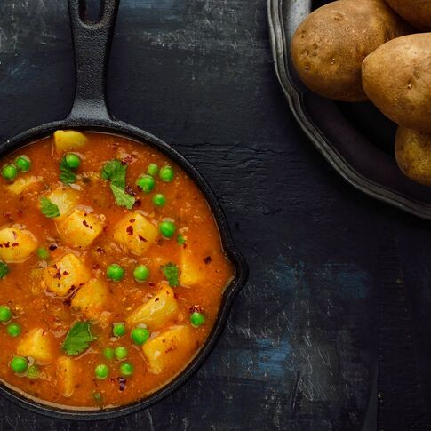 Curried Potatoes and Baby Peas (Tariwale Aloo)