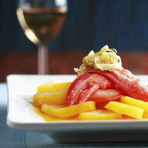 Saffron Scented Potato Medallions with Lobster and Passion Fruit Vinaigrette