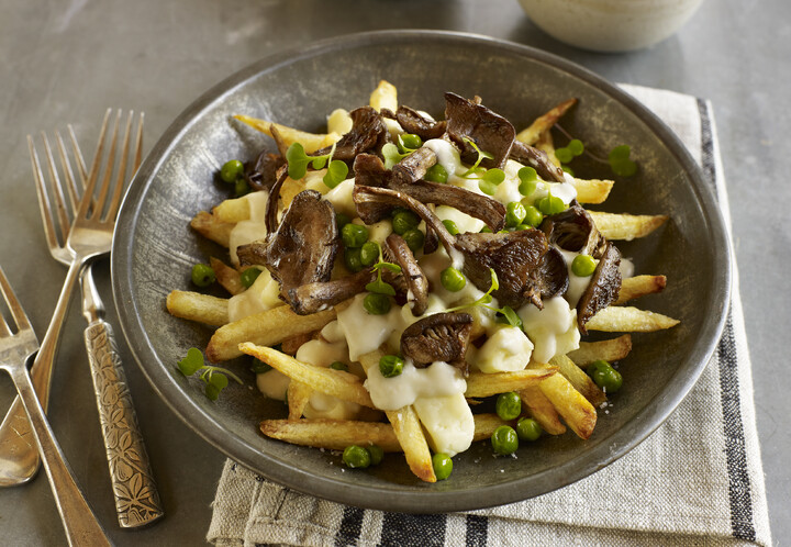 Spring Vegetarian Poutine with Fresh Spring Peas, Black Trumpet Mushrooms and Dill Béchamel