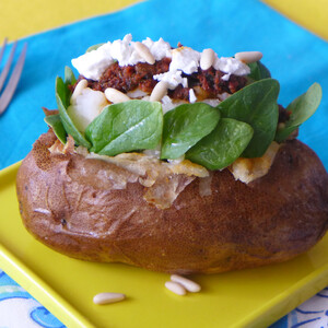 Baked Idaho® Potato with Baby Spinach, Tapenade and Goat Cheese with Pine Nuts
