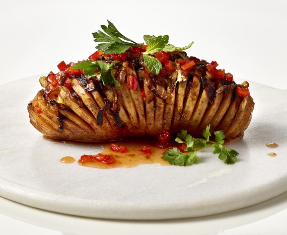 Vegan Hasselback Potato with Red Pepper Jelly and Caramelized Onions