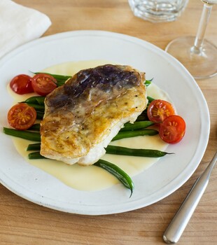 Idaho® Potato Crusted Walleye with Green Beans, Cherry Tomatoes and Beurre Blanc
