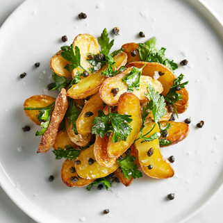 Schmaltz Roasted Potatoes with Crispy Capers and Parsley