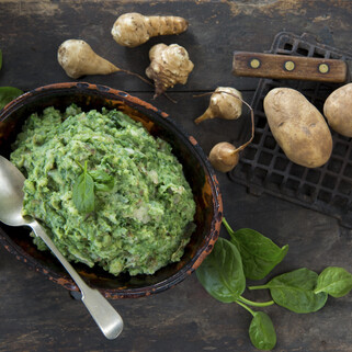 Smashed Idaho® Potatoes with Sunchokes, Roasted Garlic & Spinach 