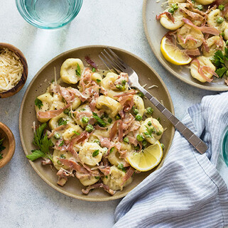 Idaho® Potato Gnocchi with Spring Peas and Prosciutto