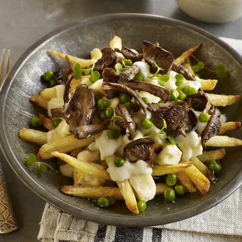 Spring Vegetarian Poutine with Fresh Spring Peas, Black Trumpet Mushrooms and Dill Béchamel