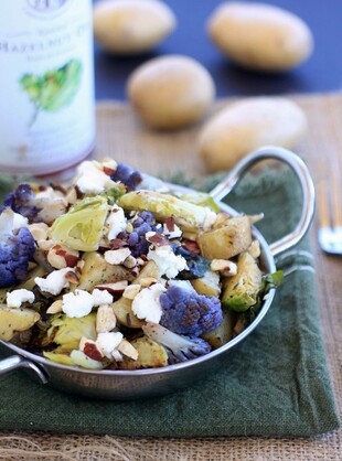 Roasted Idaho® Potatoes, Cauliflower, and Brussels Sprouts with Goat Cheese and Hazelnuts