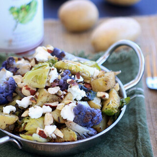 Roasted Idaho® Potatoes, Cauliflower, and Brussels Sprouts with Goat Cheese and Hazelnuts