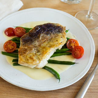 Idaho® Potato Crusted Walleye with Green Beans, Cherry Tomatoes and Beurre Blanc