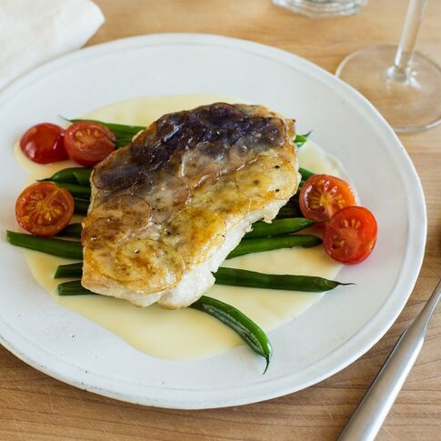 Idaho® Potato Crusted Walleye with Green Beans, Cherry Tomatoes and Beurre Blanc