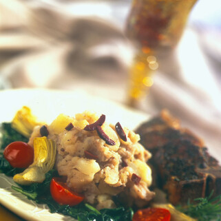 Olive Crushed Potatoes with Lamb, Spinach, Tomato and Artichokes