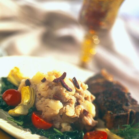 Olive Crushed Potatoes with Lamb, Spinach, Tomato and Artichokes