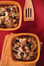 Idaho® Potato Bread Pudding With Marscapone, White Chocolate, Dried Cherries, and Praline Crème Anglaise