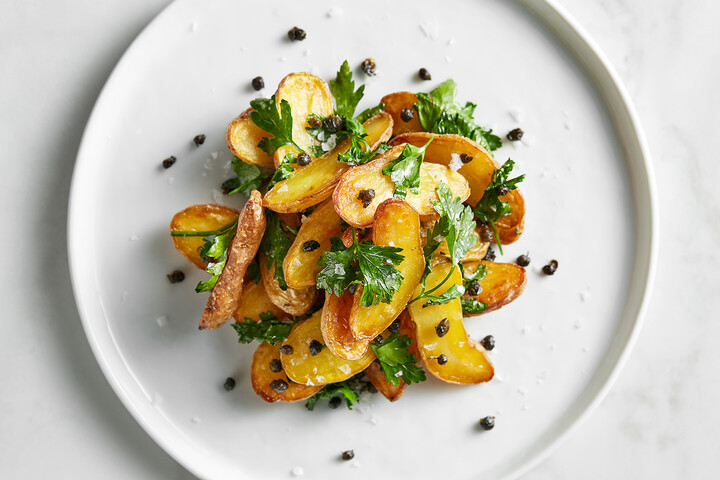 Schmaltz Roasted Potatoes with Crispy Capers and Parsley