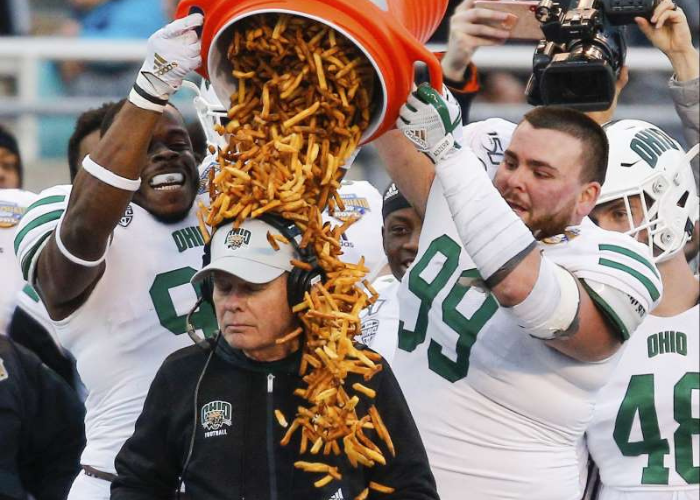 The Ohio Bobcats head coach Frank Solich was doused with french fries after winning the 2019 Famous Idaho® Potato Bowl.